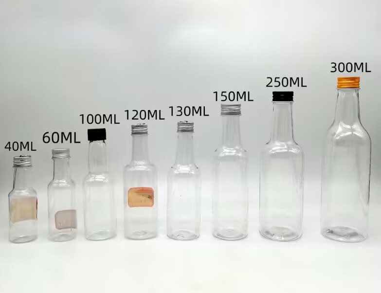 Small Plastic Wine Bottle 30ml 50ml 100ml  120ml 130ml Food Grade Whisky Dispenser Bottles Clear Milk Glasses with Safety Cover