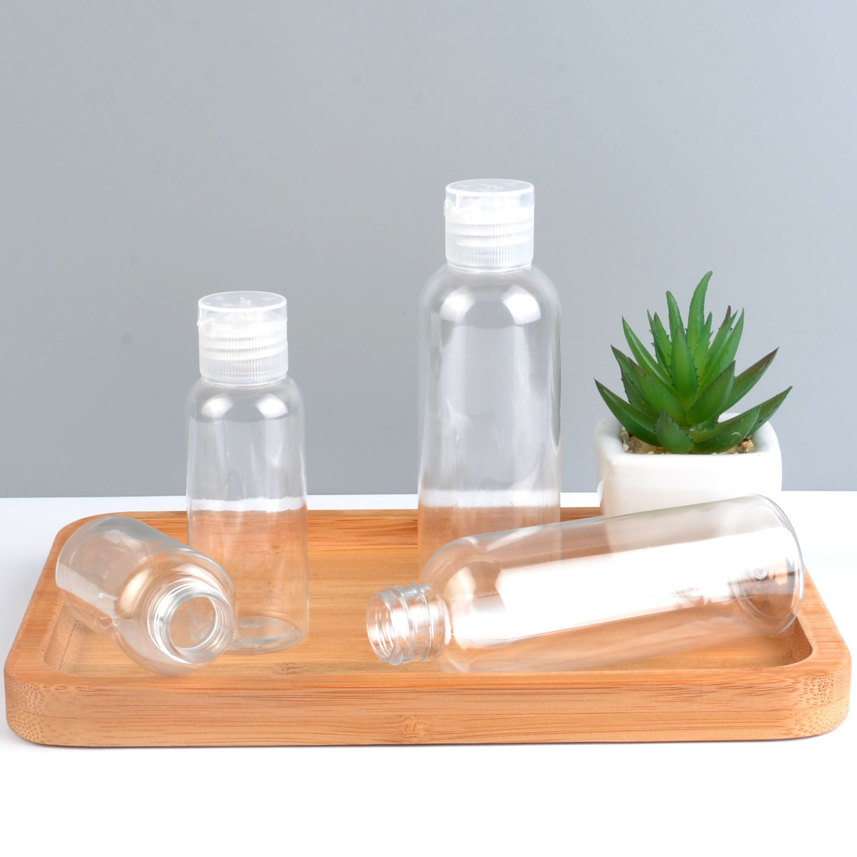 Wholesale Hand Sanitizer Bottle 30ml 50ml Pocket Perfume Container Squeeze Hand Sanitizer Bottles Customized Logo with flip ca